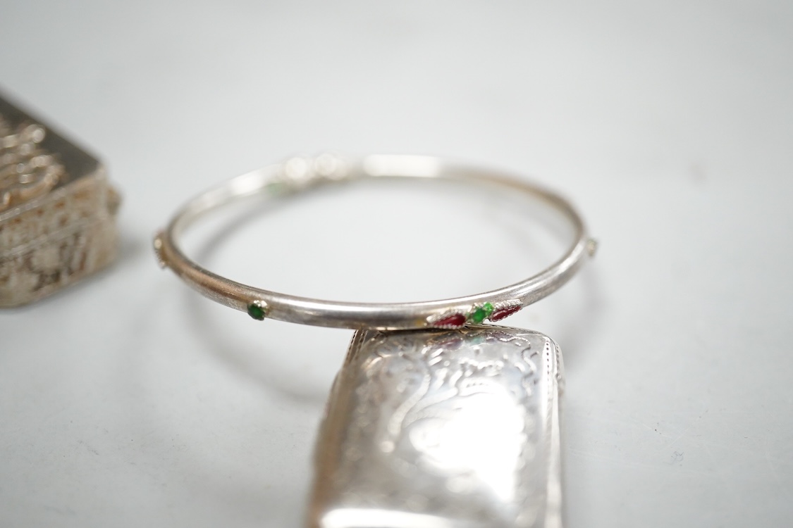 A small group of silver items including a William IV vinaigrette, William Simpson, Birmingham, 1835, 30mm, a later stamp case, two mounted photograph frames, two hinged bangles, together with a group of sterling or white